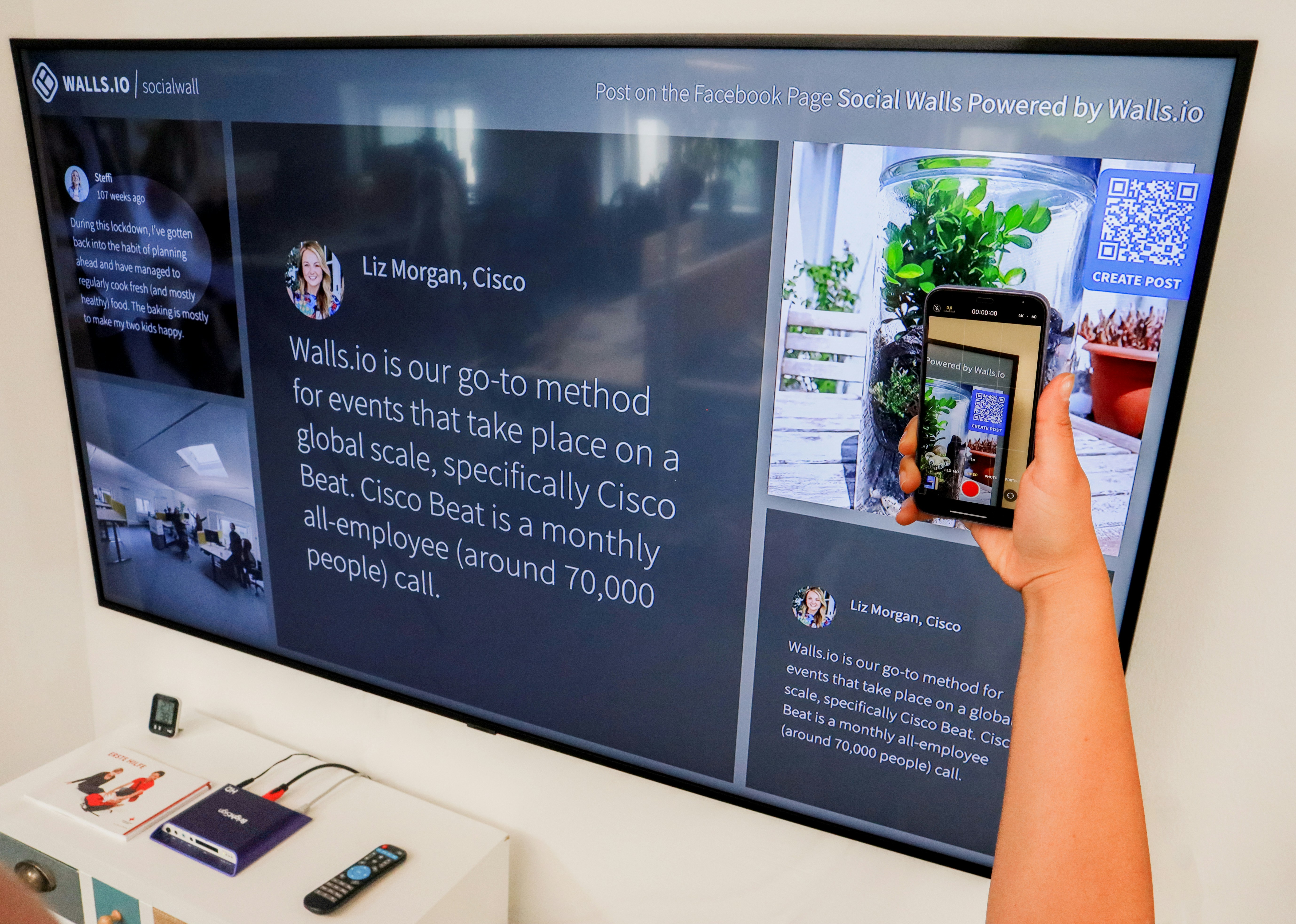 Screen at wall with smartphone in front